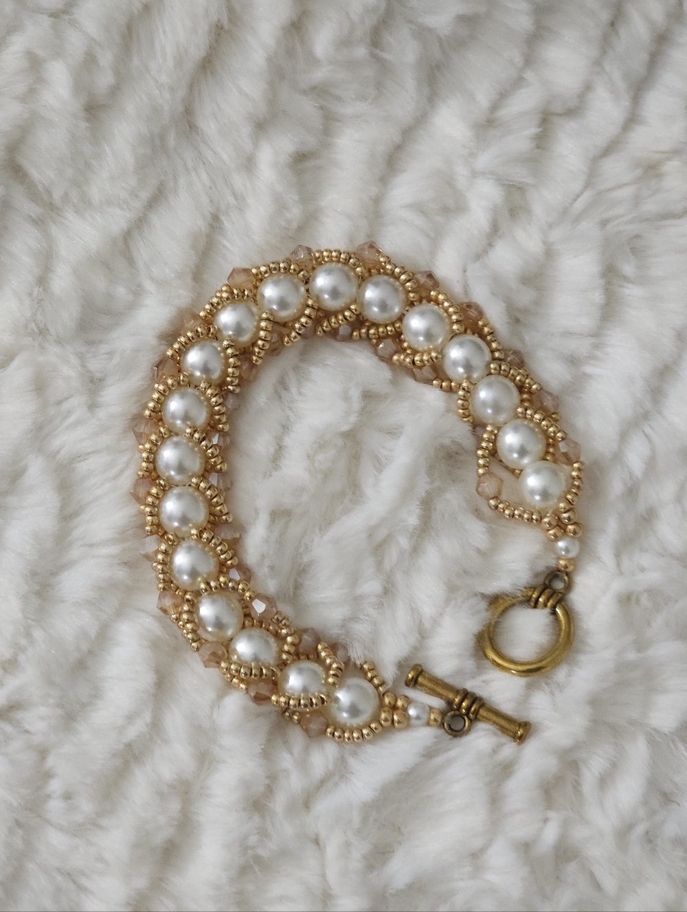 Elegant Gold and Pearl Flat Spiral Bracelet